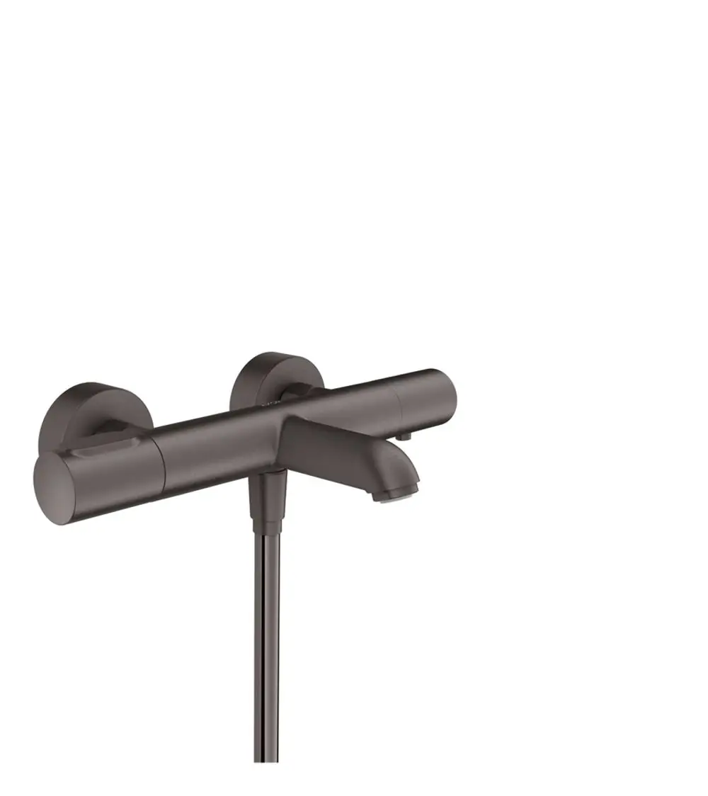 Wandmontierter Thermostat mit zwei Bedienelementen und Wasserhahn von AXOR in brushed black chrome. Klare Linienführung ohne sichtbare Schläuche oder Leitungen.